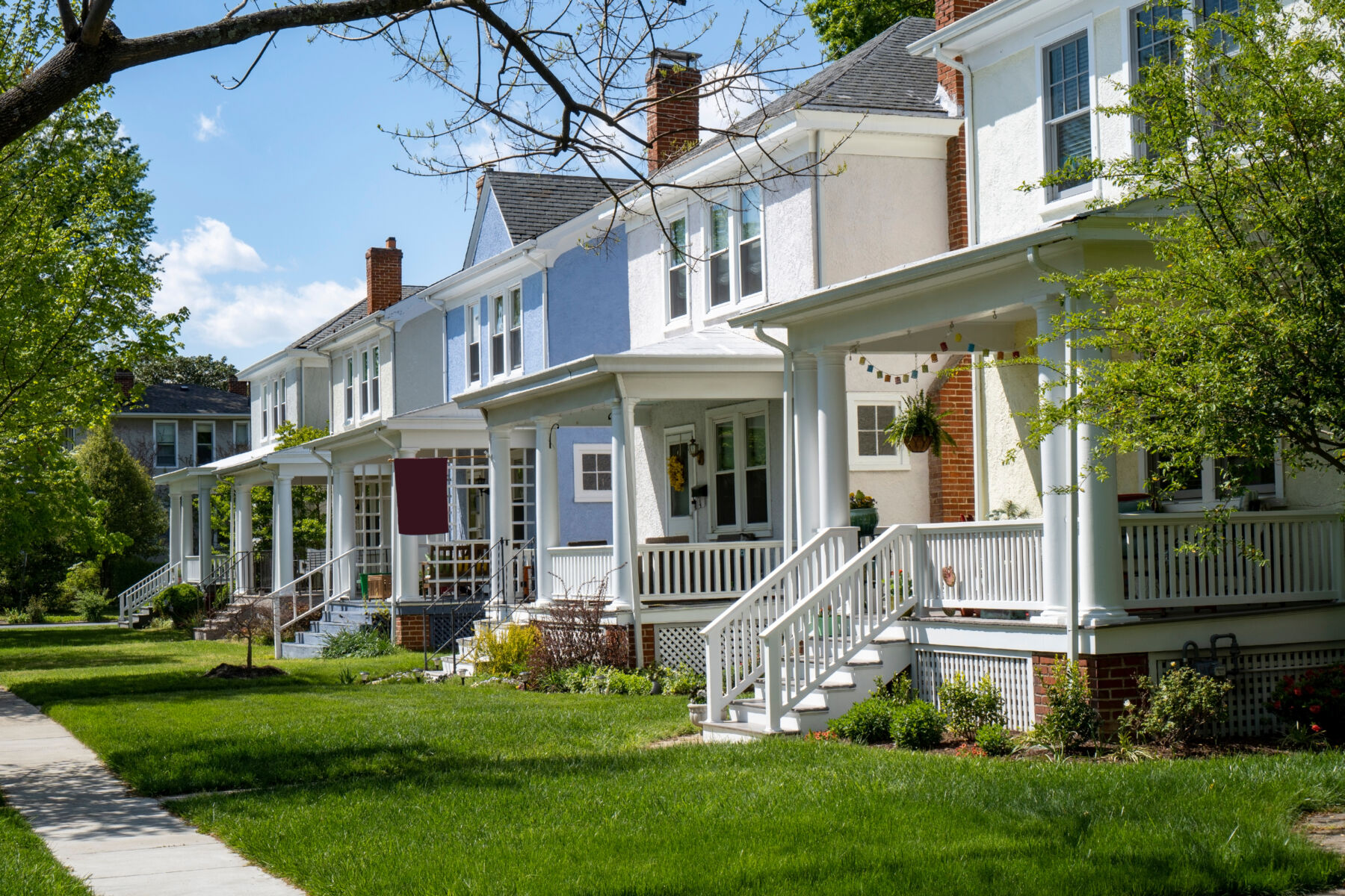 A row of older homes in a neighborhood.