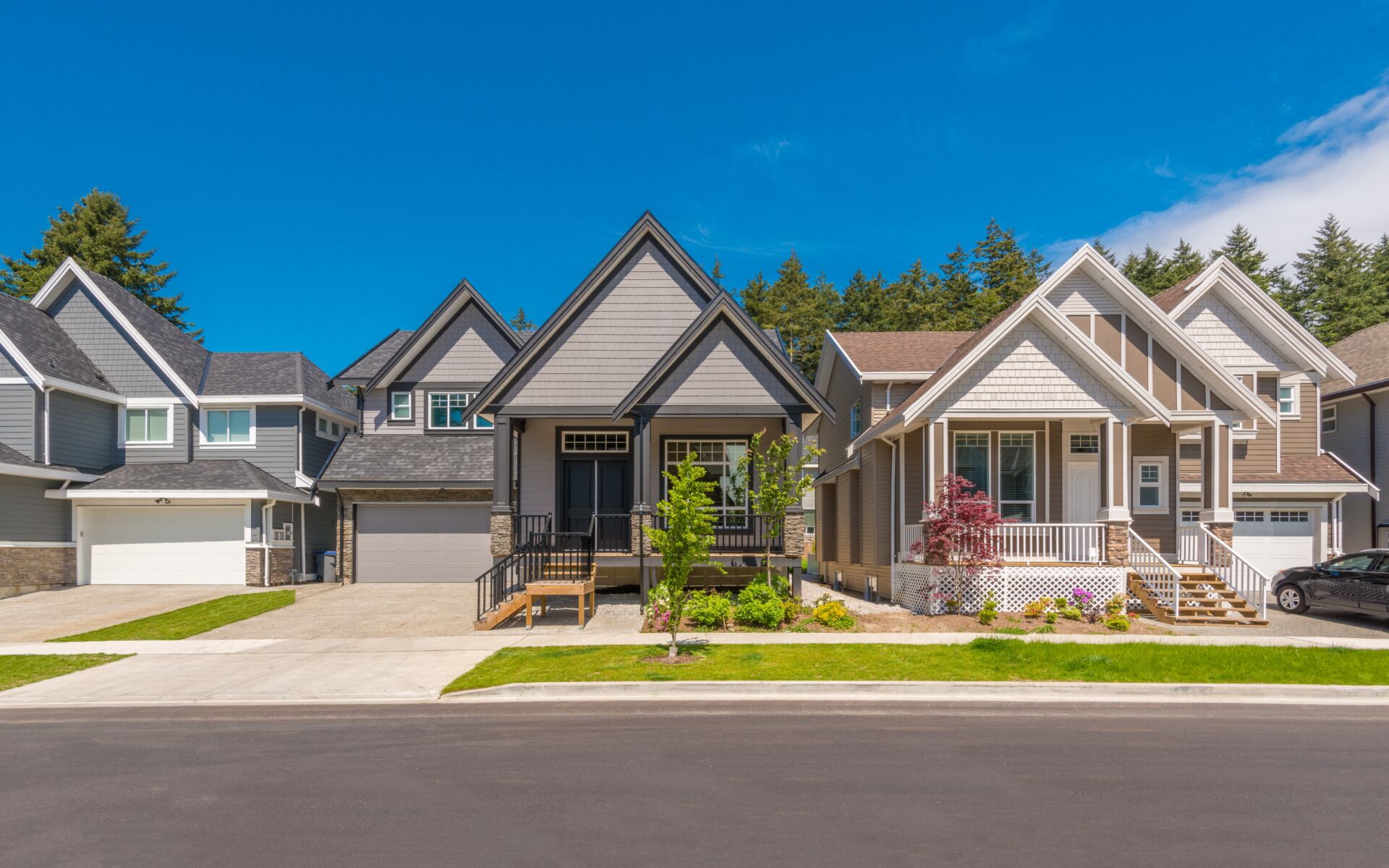 A row of new homes in a suburban neighborhood.