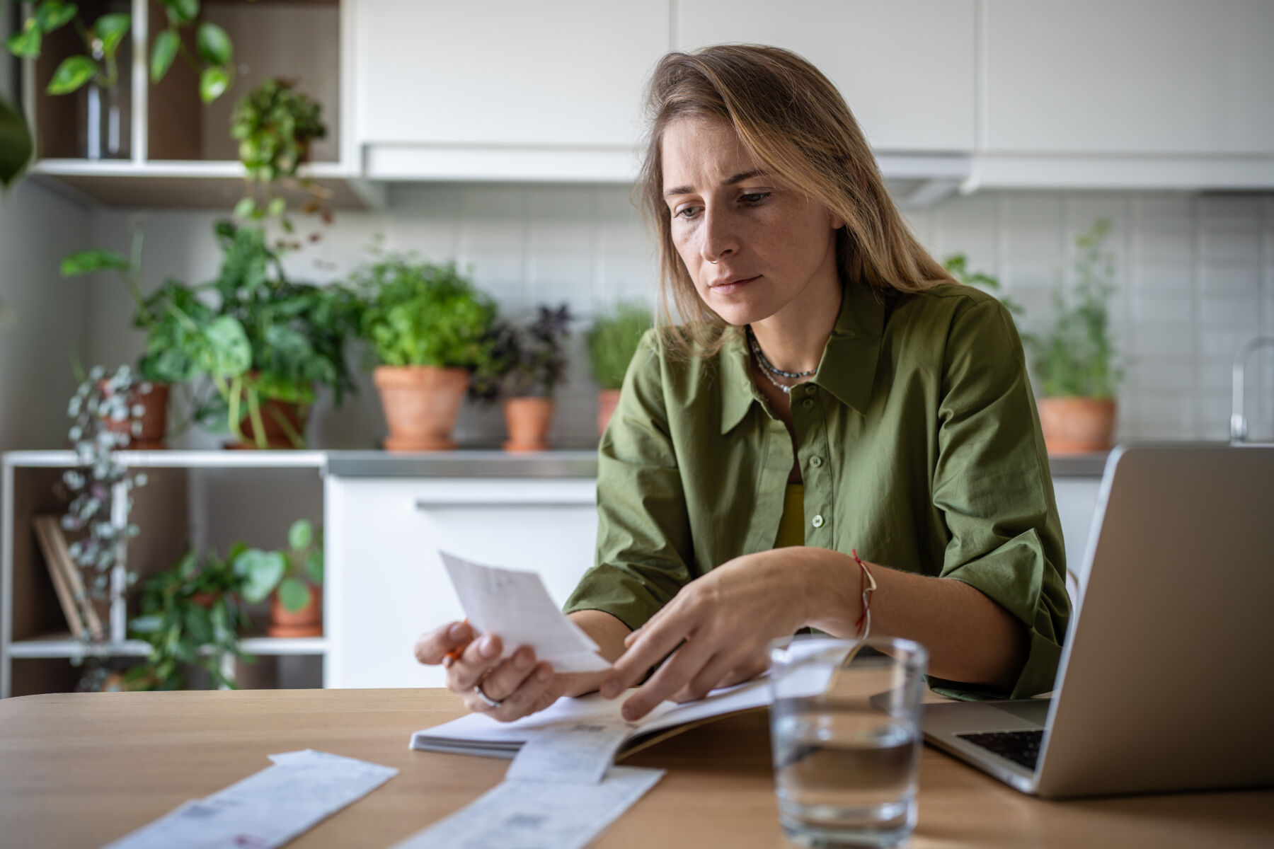 Photo shows woman verifying her income for a PadSplit rental on her laptop.
