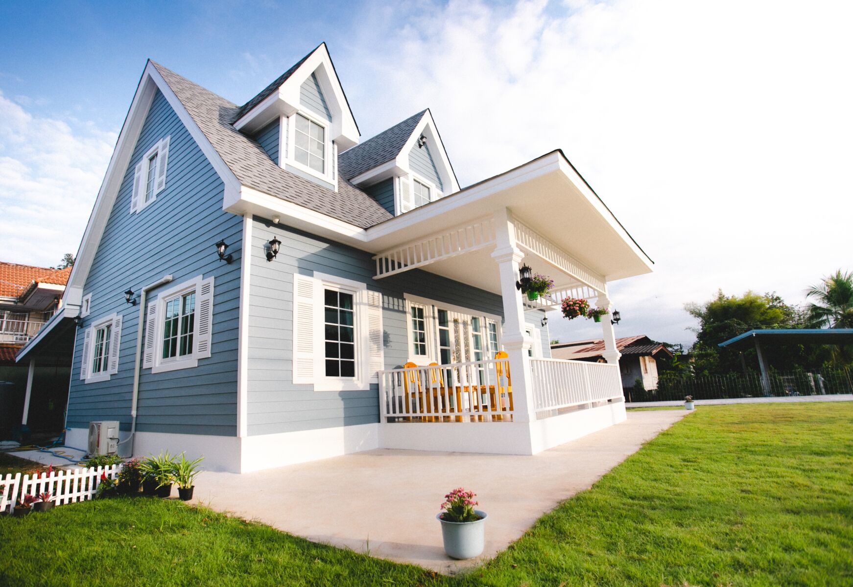 An exterior view of a classic blue home.