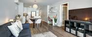 Shared common areas and private room options for student housing.