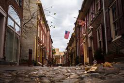 Photo shows Elfreth's Alley offering a glimpse into the city's colonial past with its charming cobblestone path and historic homes.
