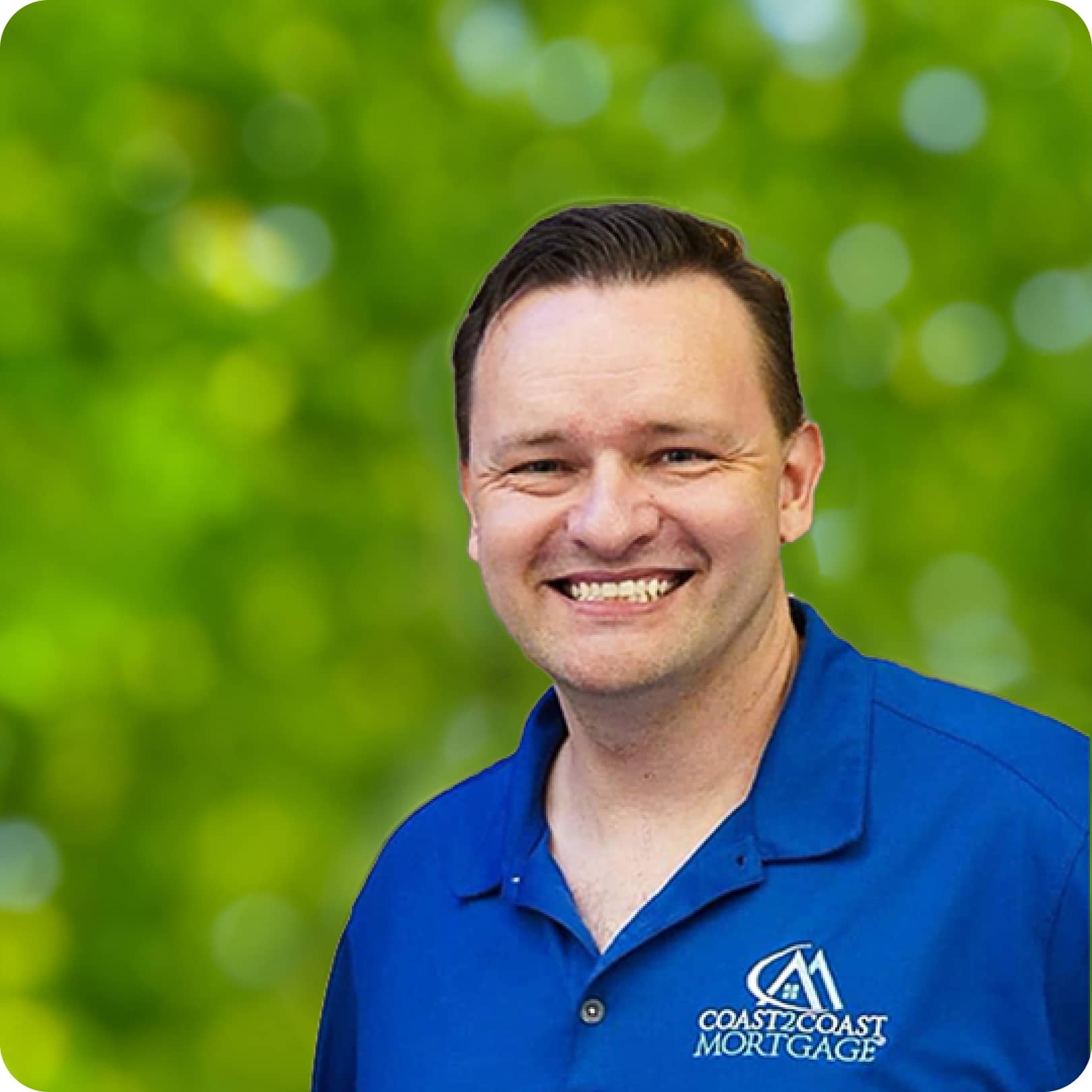 A photo of a Caucasian man in a blue collared shirt