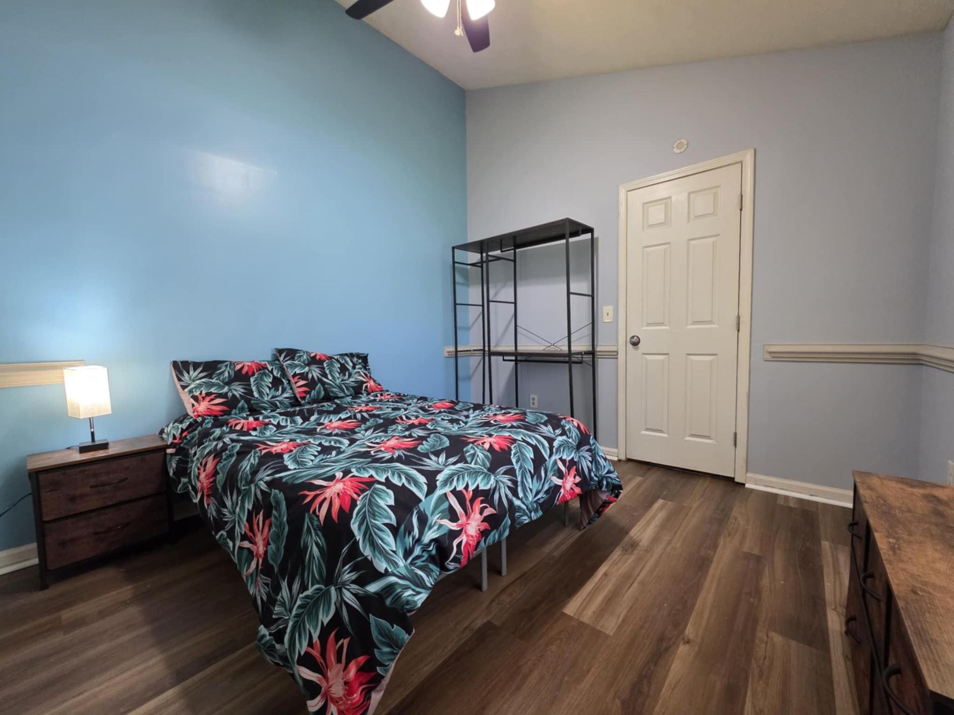 High ceilings and higher end furnishings with a ceiling fan!