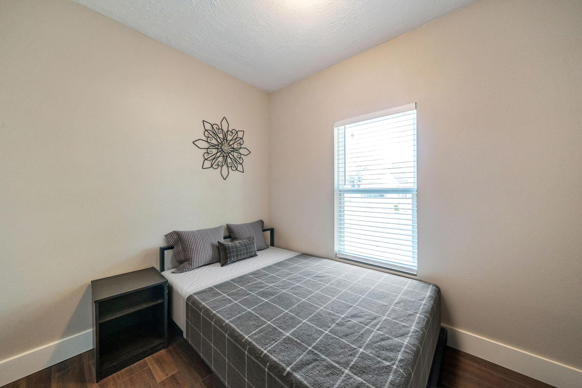 bedroom, detected: window blind, bed