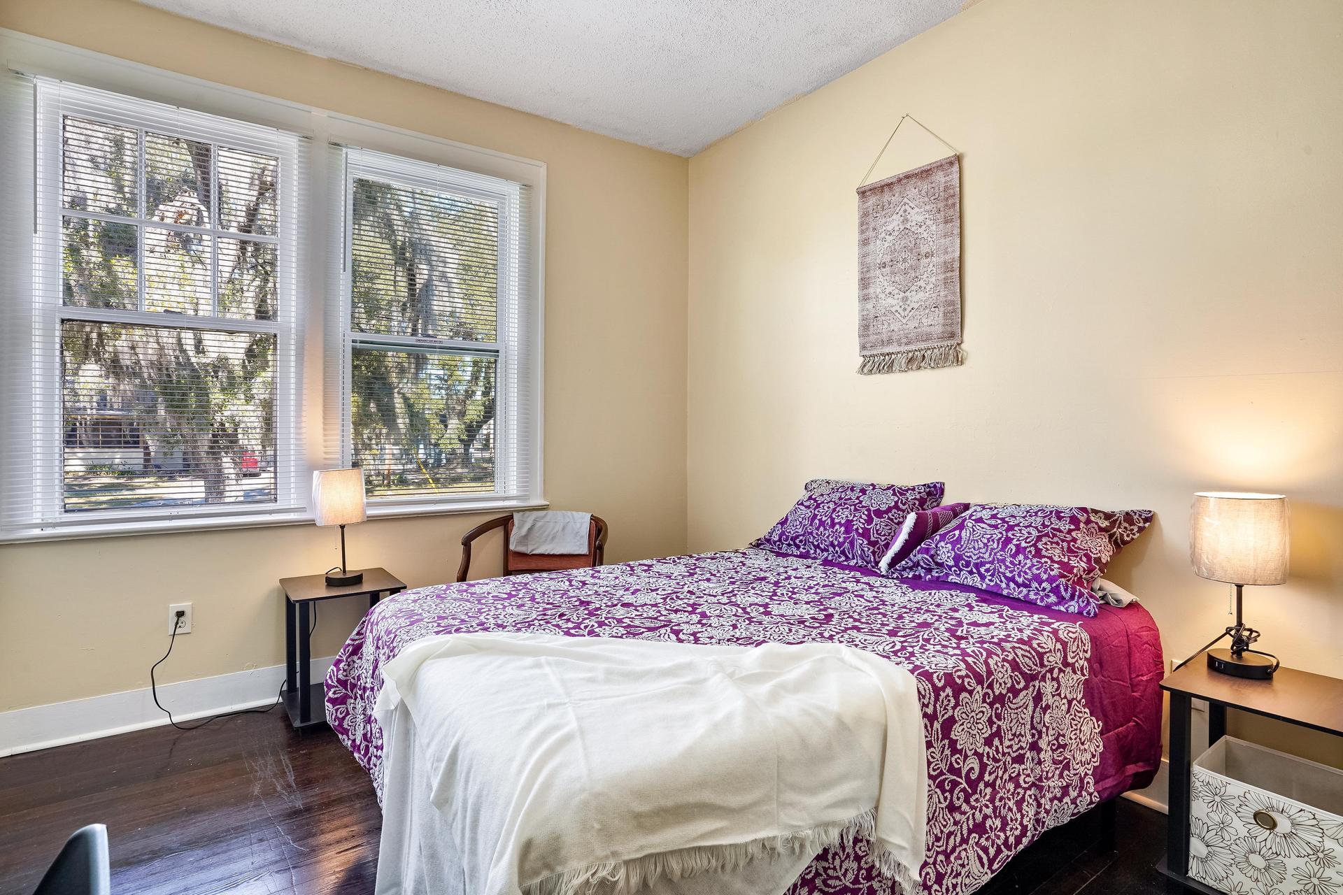 Room 4 is our spacious room equipped with full bed, linens, TV, mini fridge, desk, chair, nightstand, clothing rack