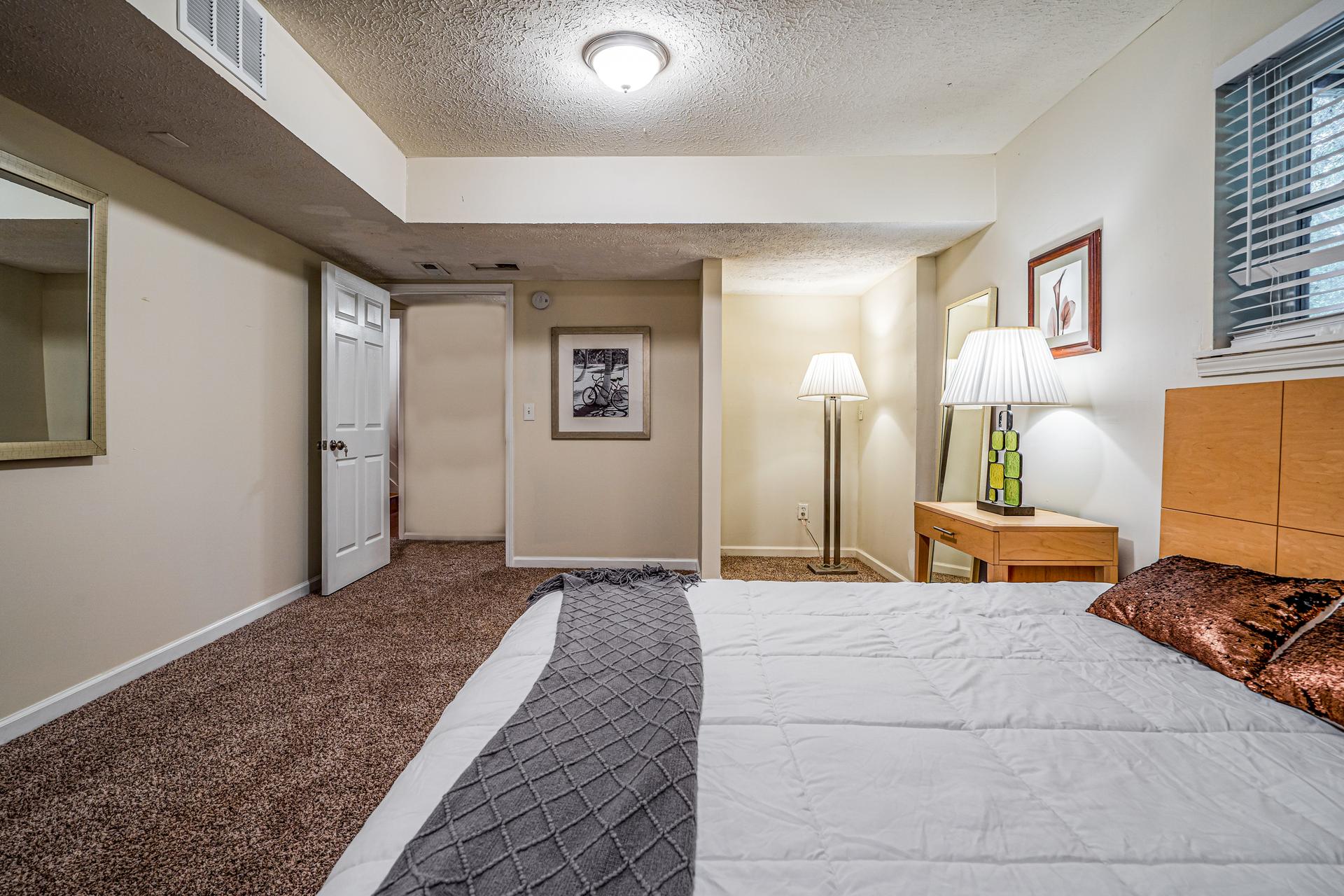 bedroom, detected: window blind, bed, carpet