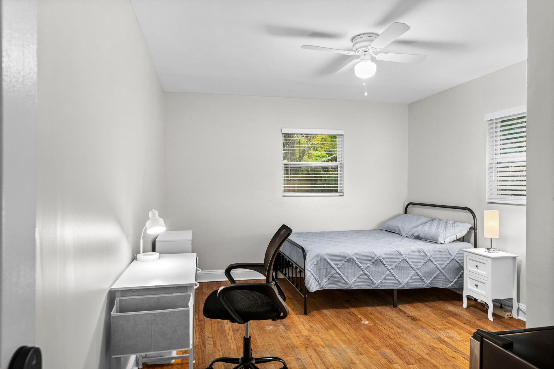 Bedroom with natural light. Full bed with memory foam 10" mattress. Night stand with phone charger and dresser
