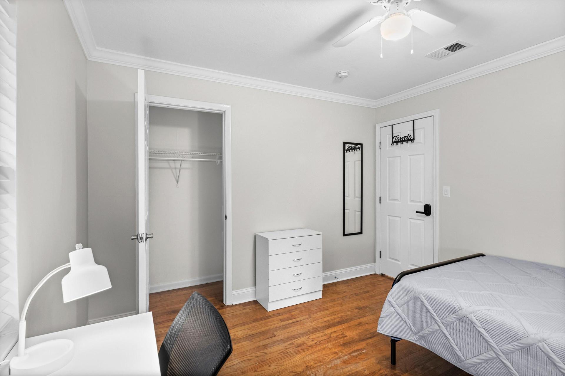 Large closet, dresser & ceiling fan