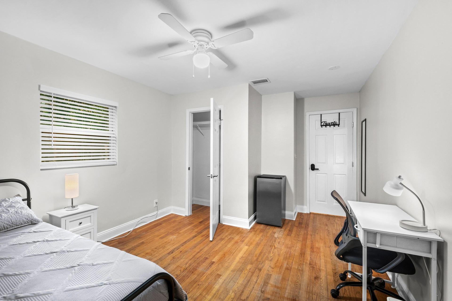 Large closet, mini fridge, desk with lamp & office chair plus ceiling fan