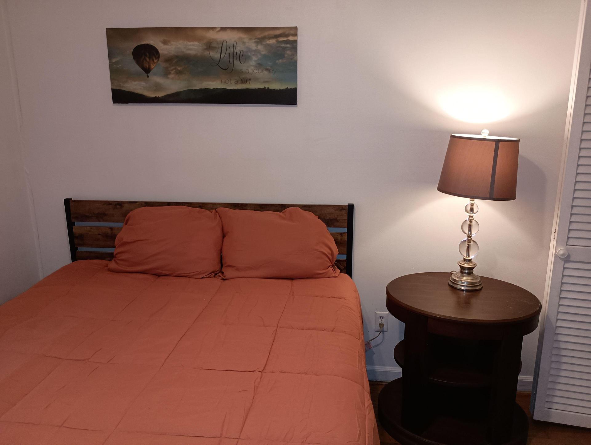 Queen bed with nightstand
