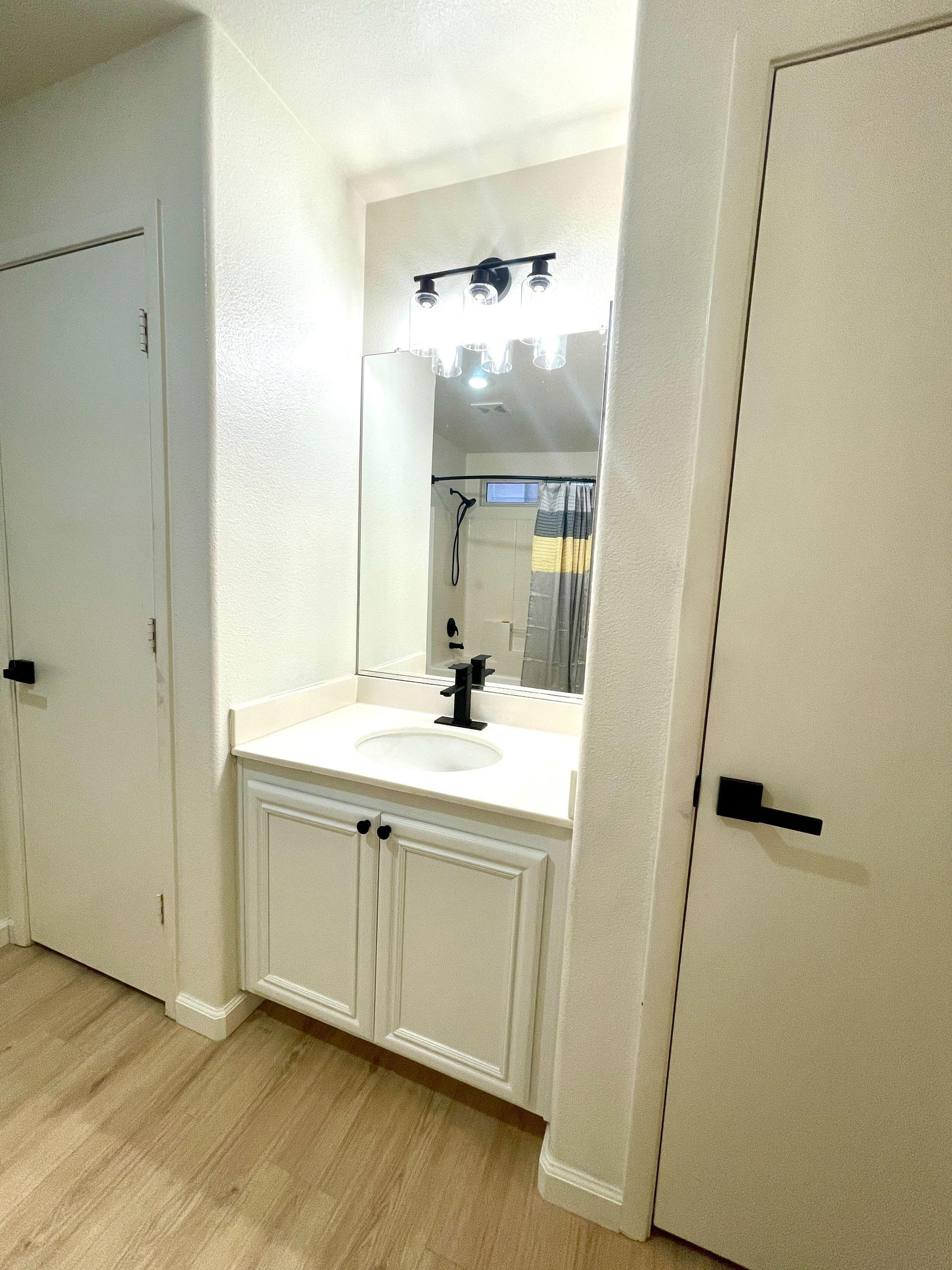 Sink vanity with closet storage on both sides