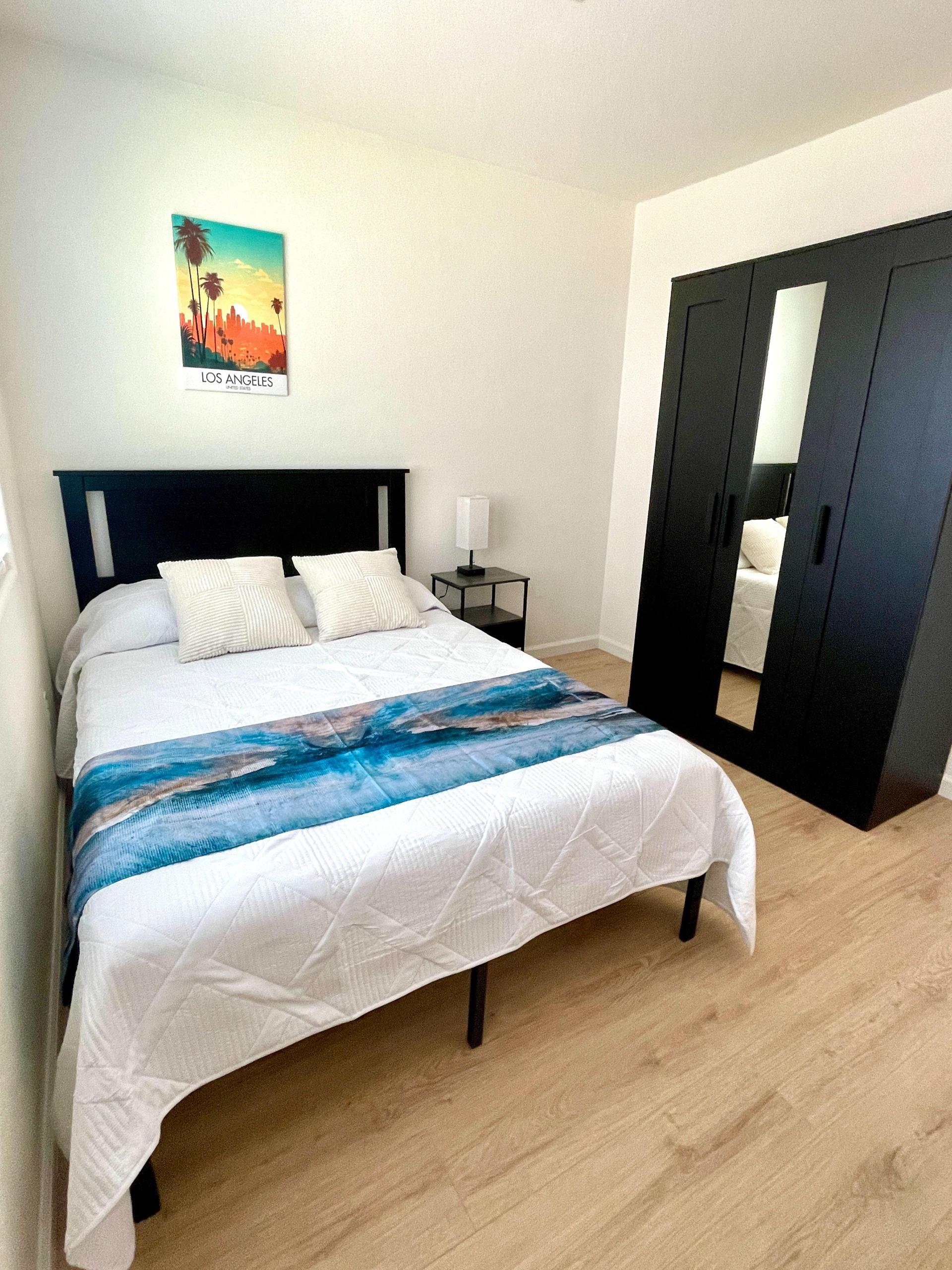 Queen size bed with memory foam mattress and large wardrobe closet