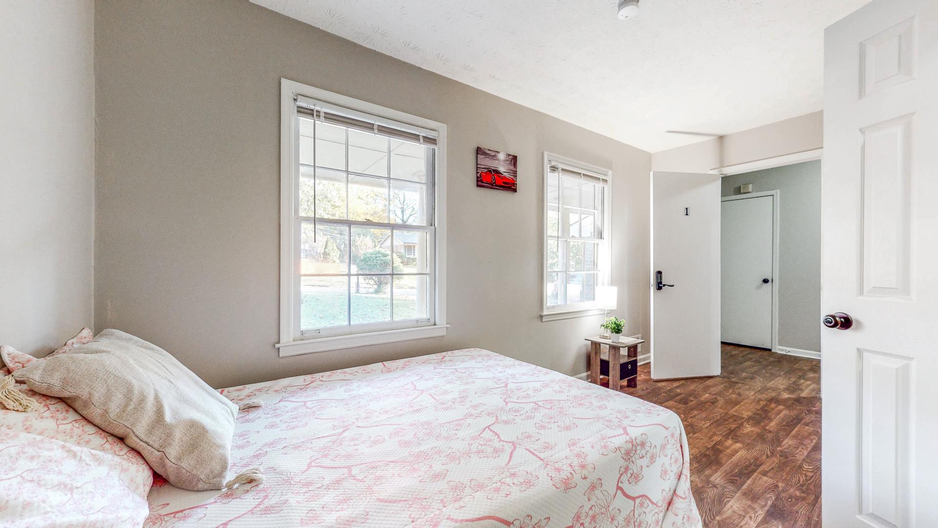 bedroom, detected: window blind, bed, ceiling fan