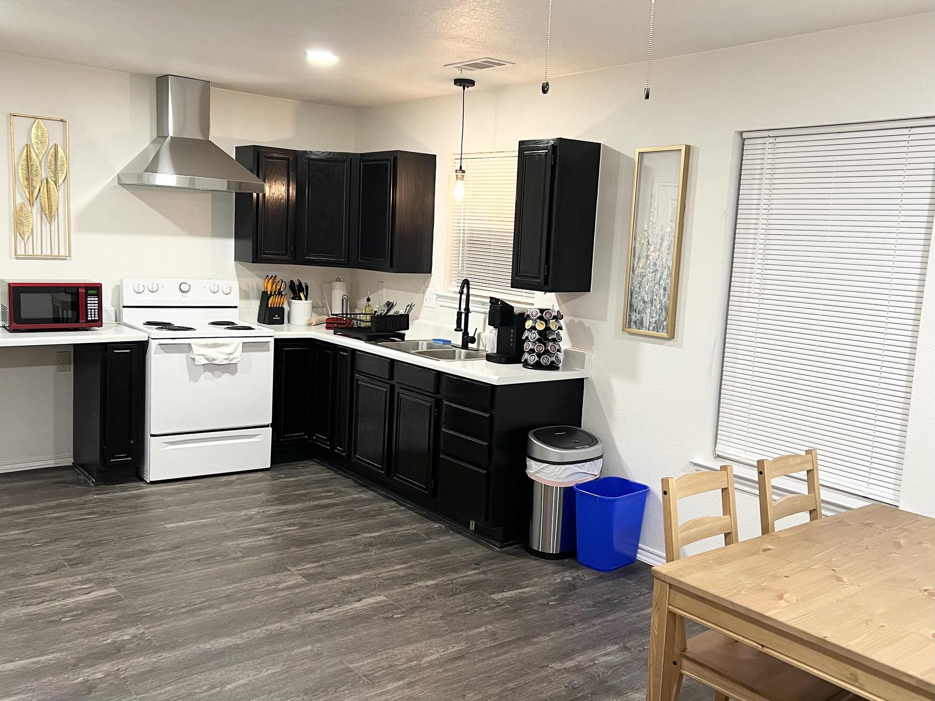 Private kitchen and dining area inside room.
