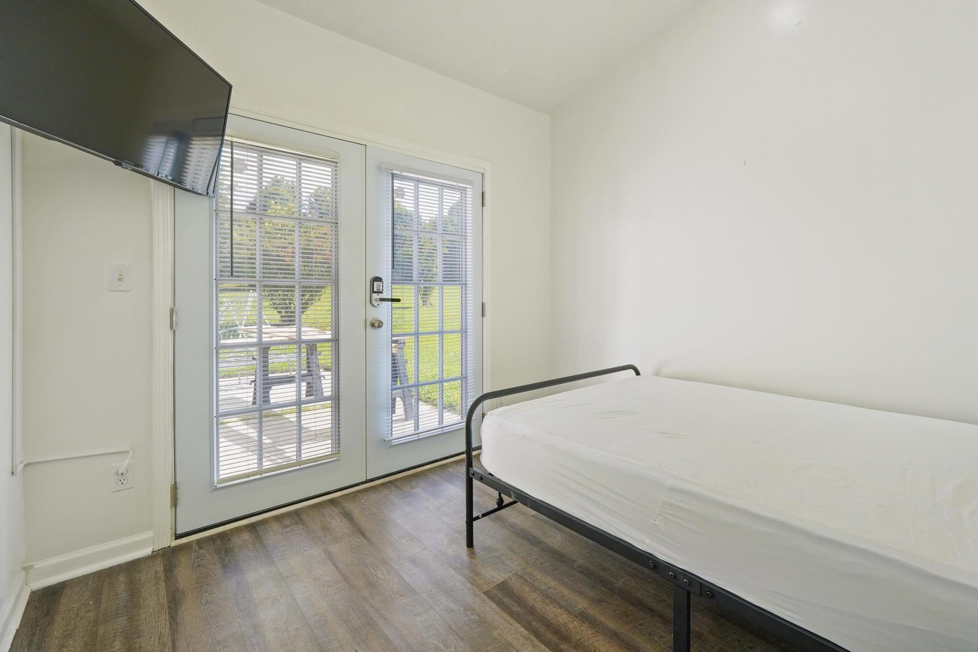 Private Entrance featuring beautiful french doors.