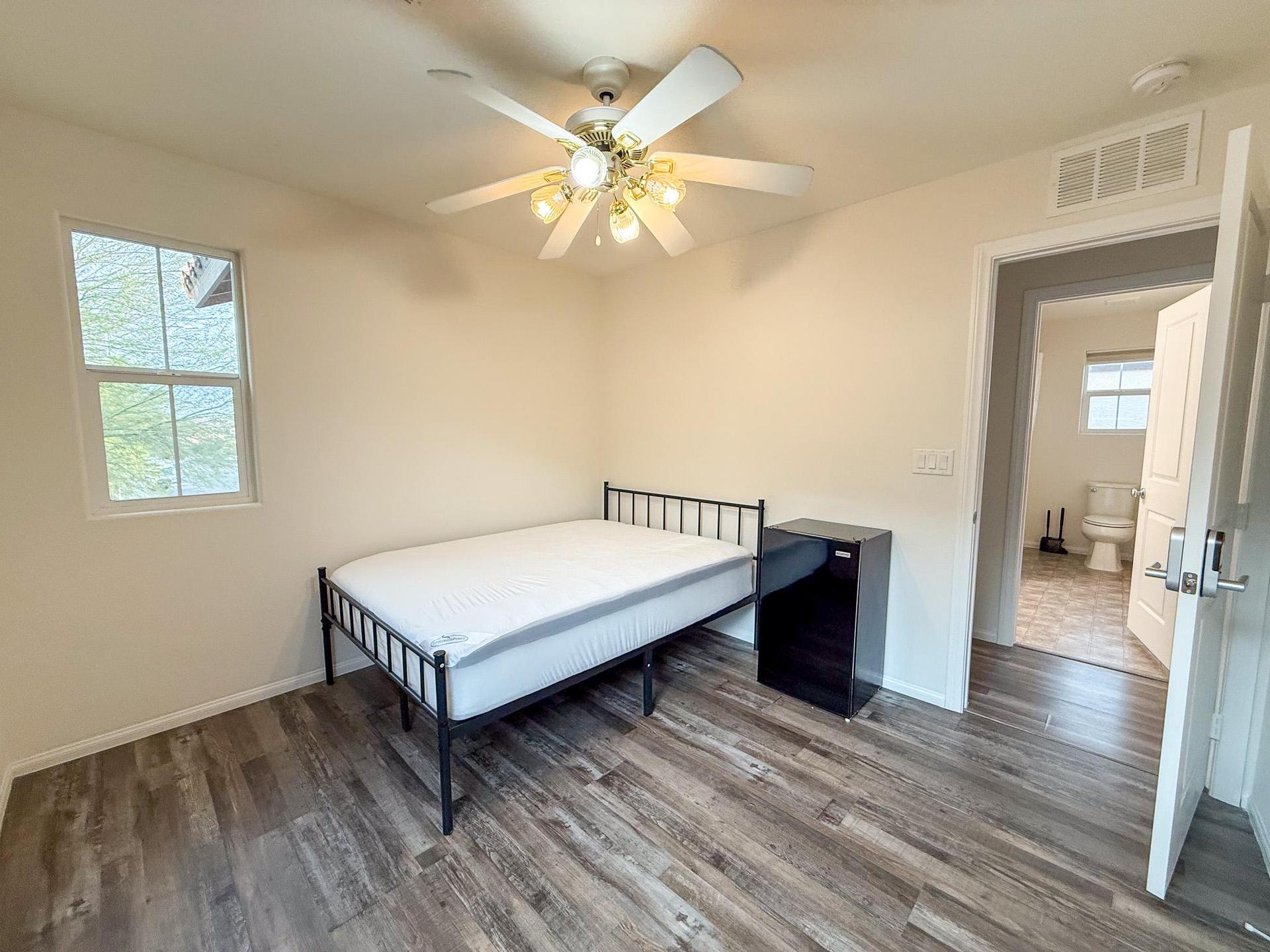 Bedroom #4 with Ceiling fan and mini fridge