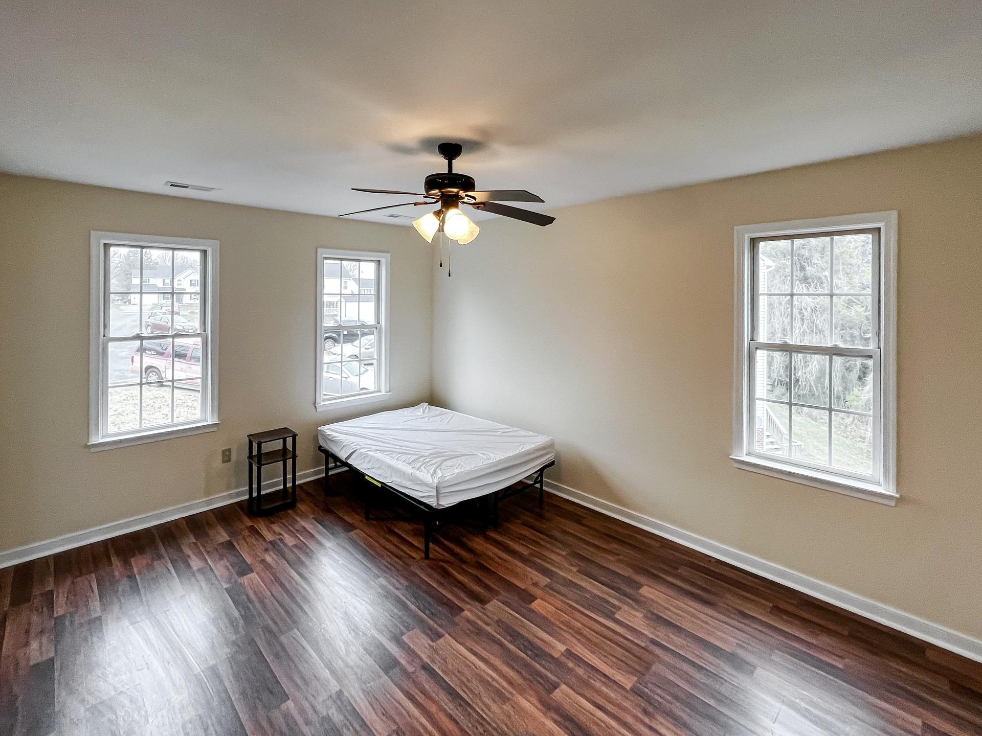 bedroom, detected: window blind, ceiling fan