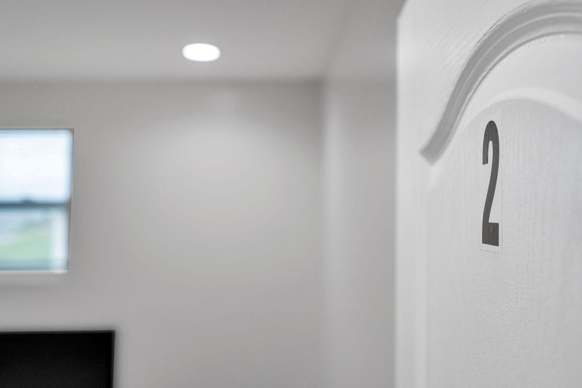 Cozy and newly renovated room with a comfortable bed, modern lighting, and a smart TV for your entertainment.