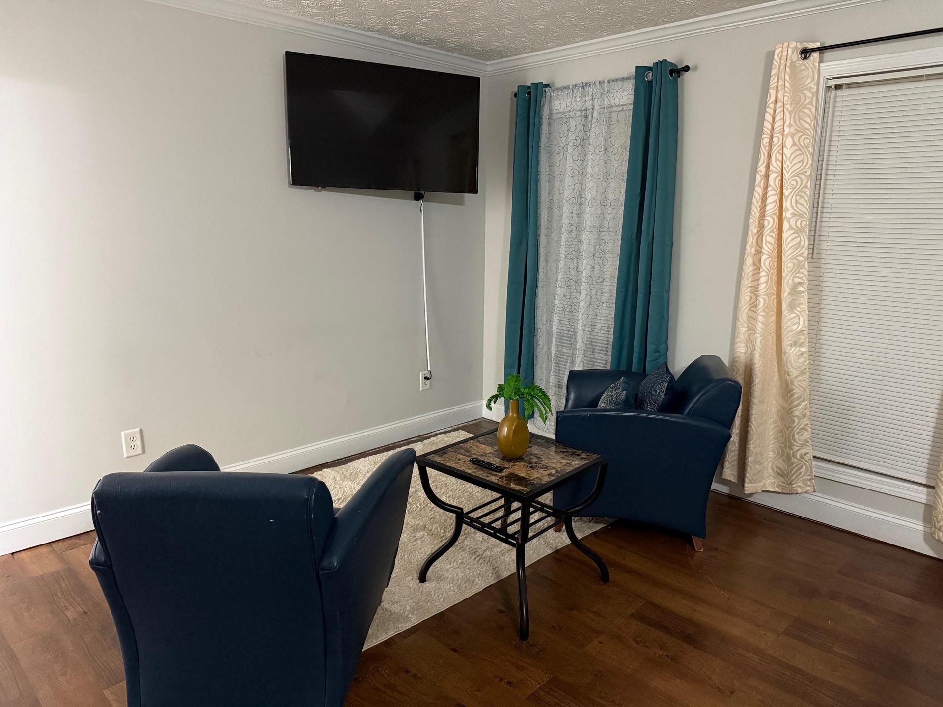 Master the art of comfort with a spacious suite, elegant sitting area