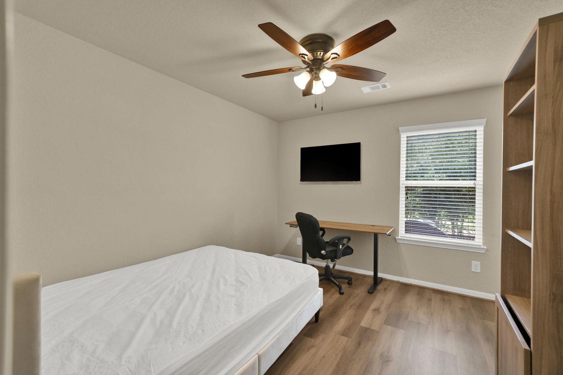 Adjustable Desk and Mounted TV