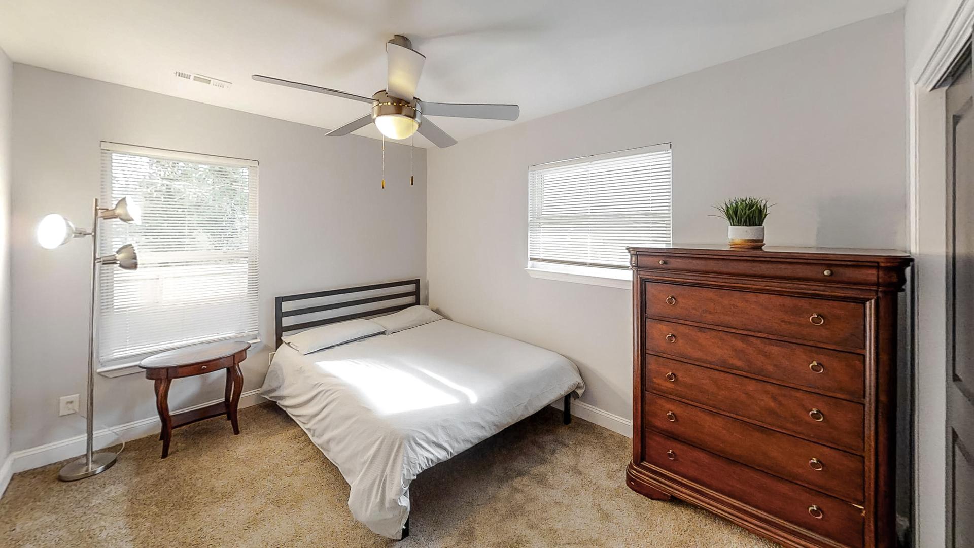 bedroom, detected: window blind, ceiling fan, bed