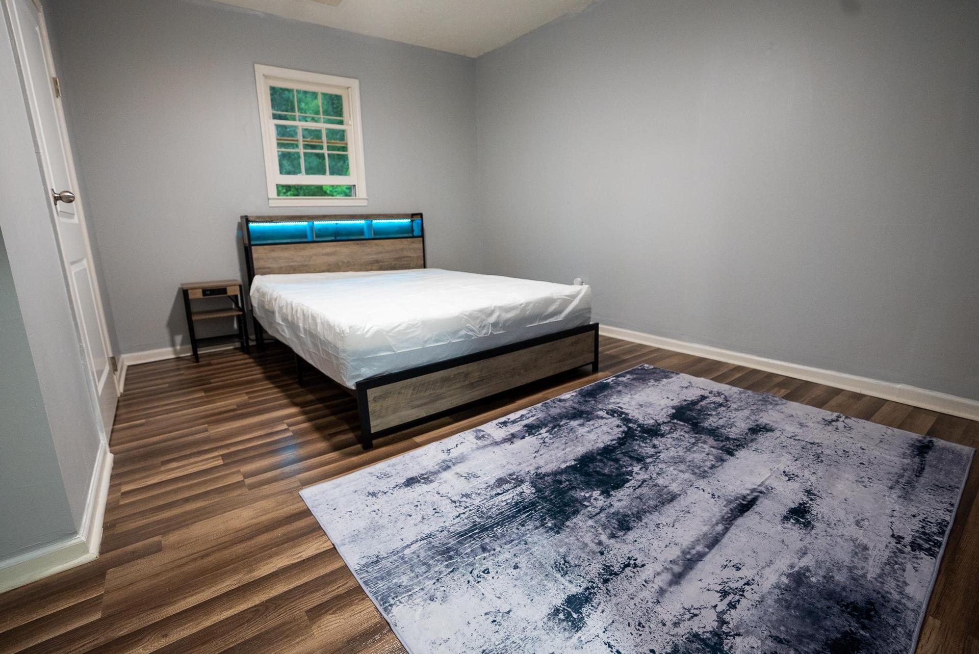 Queen Bed with Area rug, LED lights and under bed storage