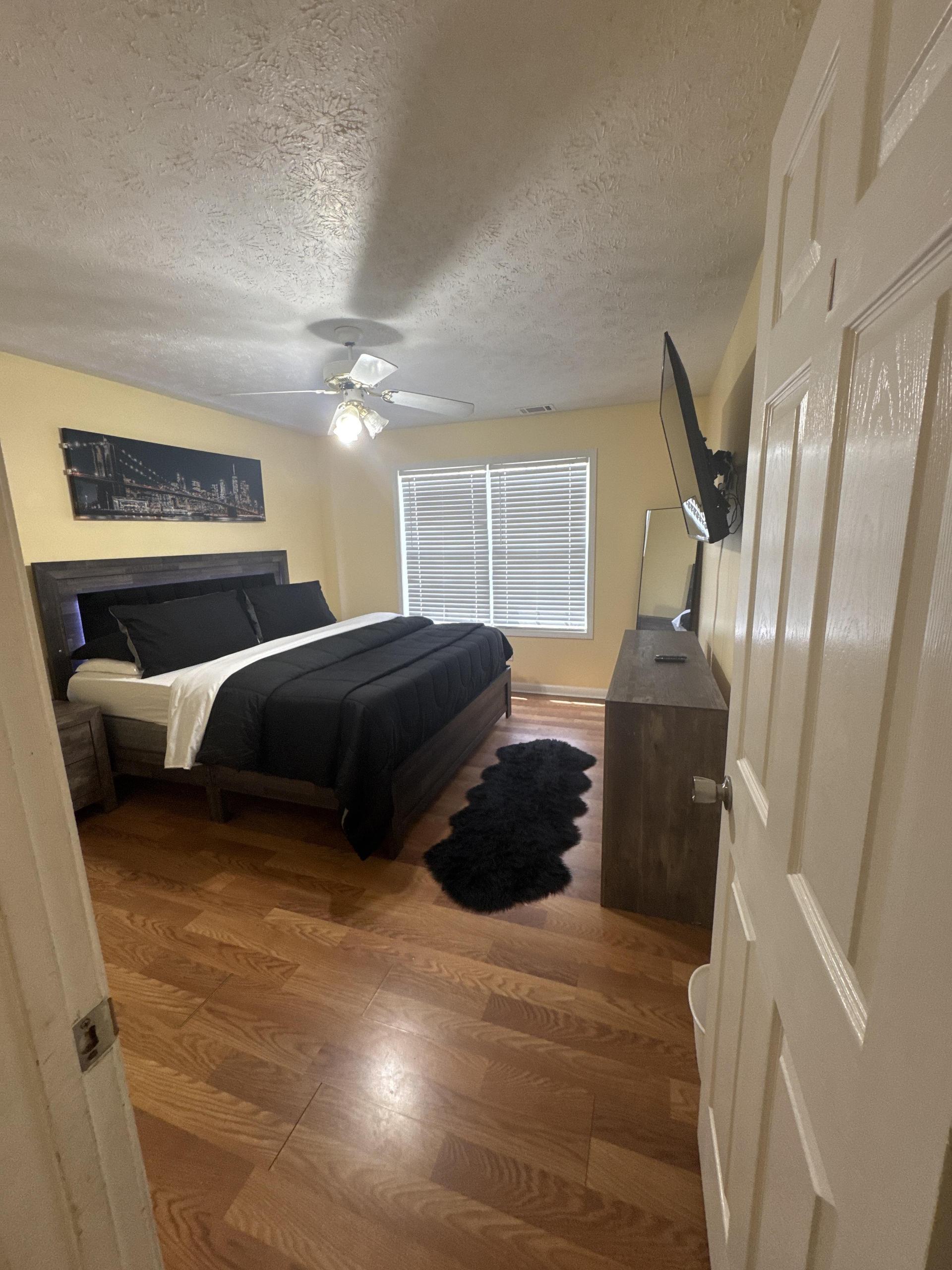 2nd bdrm Cali Kg bed, Light up headboard, dresser and 2 night stands with 50 inch flatscreen, fire stick and walk in closet