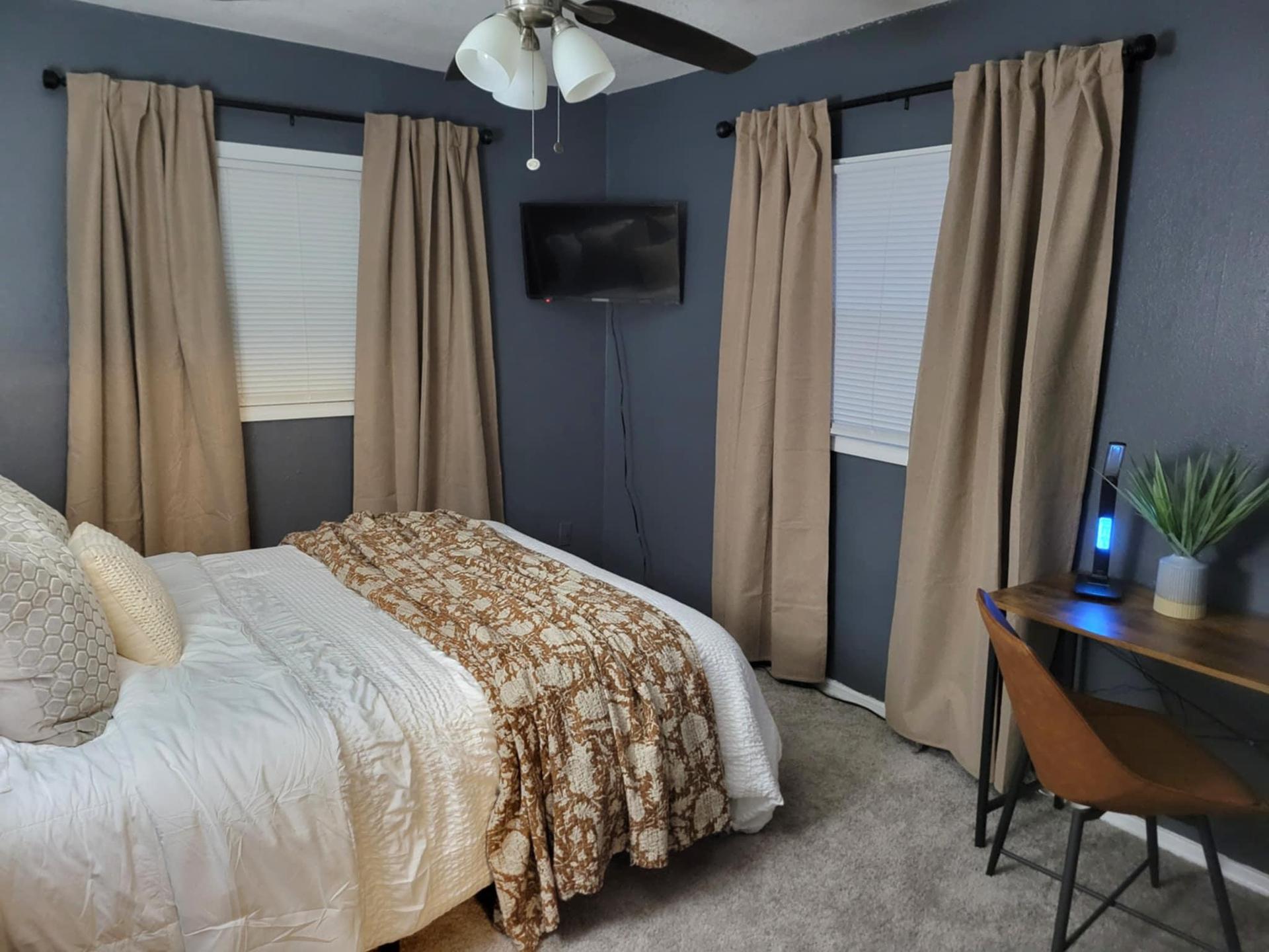 Main floor bedroom with private full bath located around the corner.