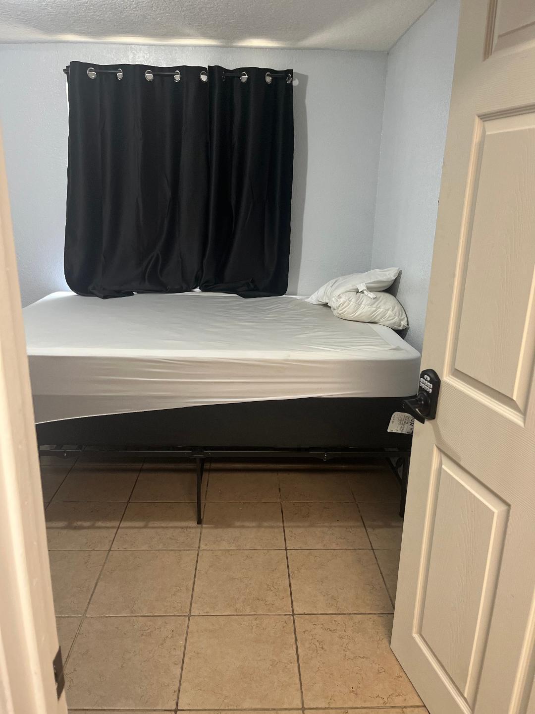 Large room with access to the laundry room from the inside. also comes with a drawer and a desk.