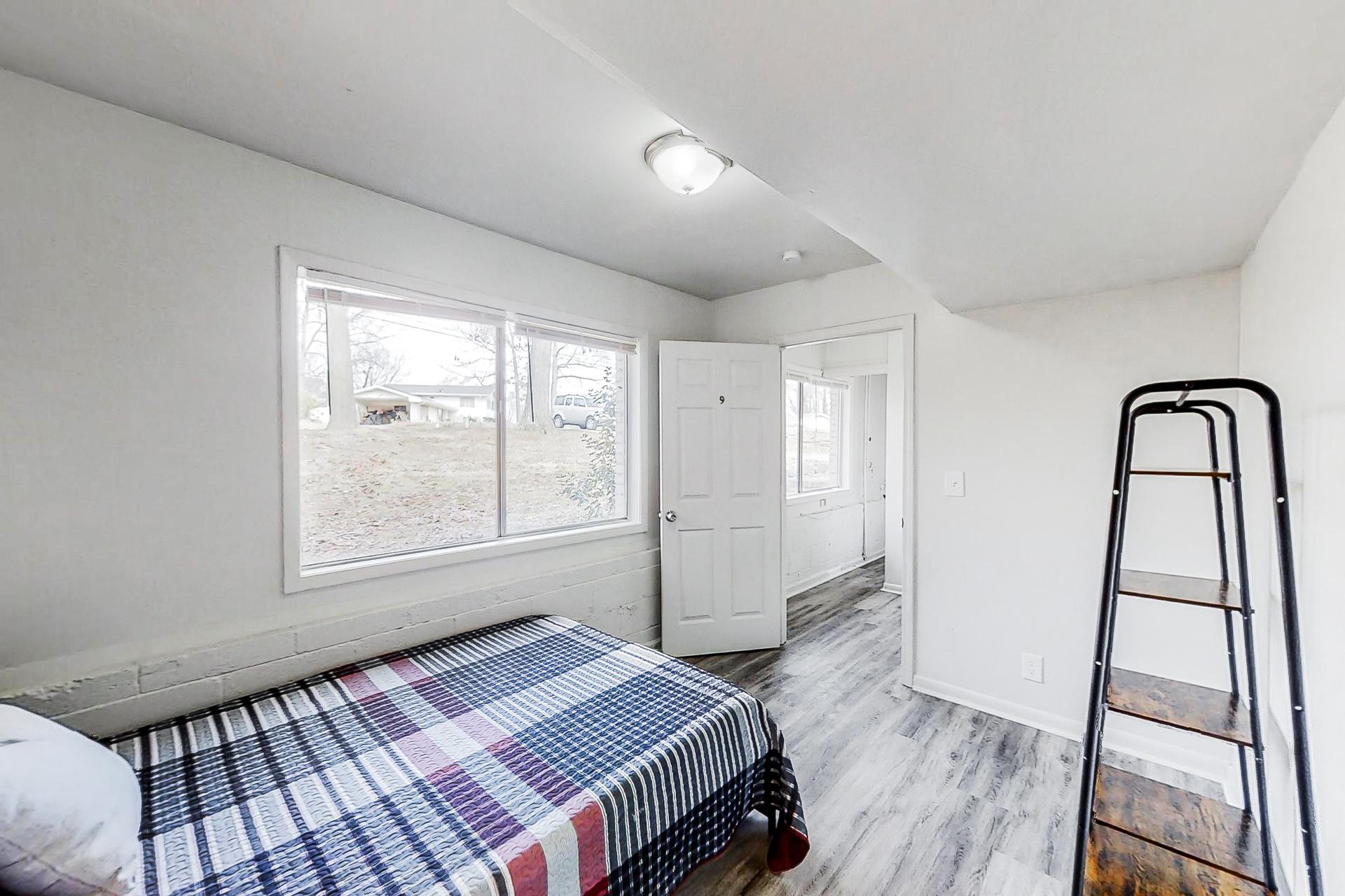 bedroom, detected: window blind, bed