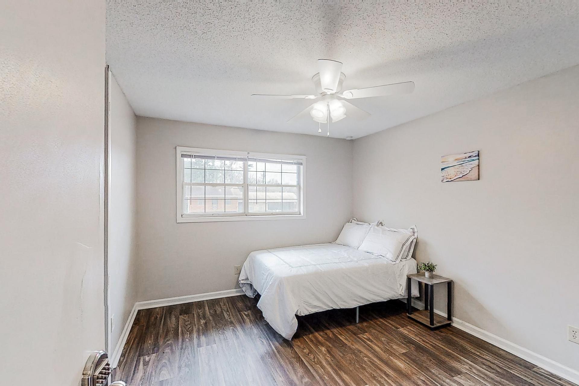 bedroom, detected: window blind, ceiling fan, bed