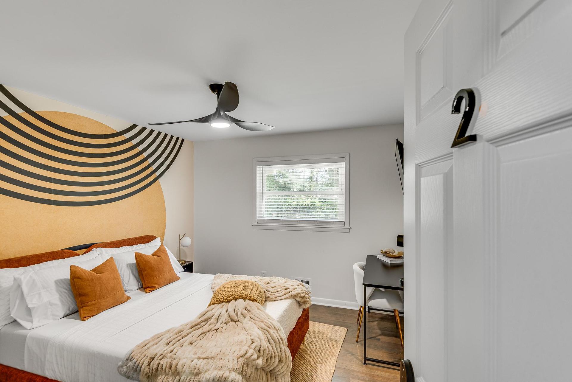 Queen Bedroom with modern design located on the 2nd floor. It comes with a desk, extra sitting area, closet, lamps