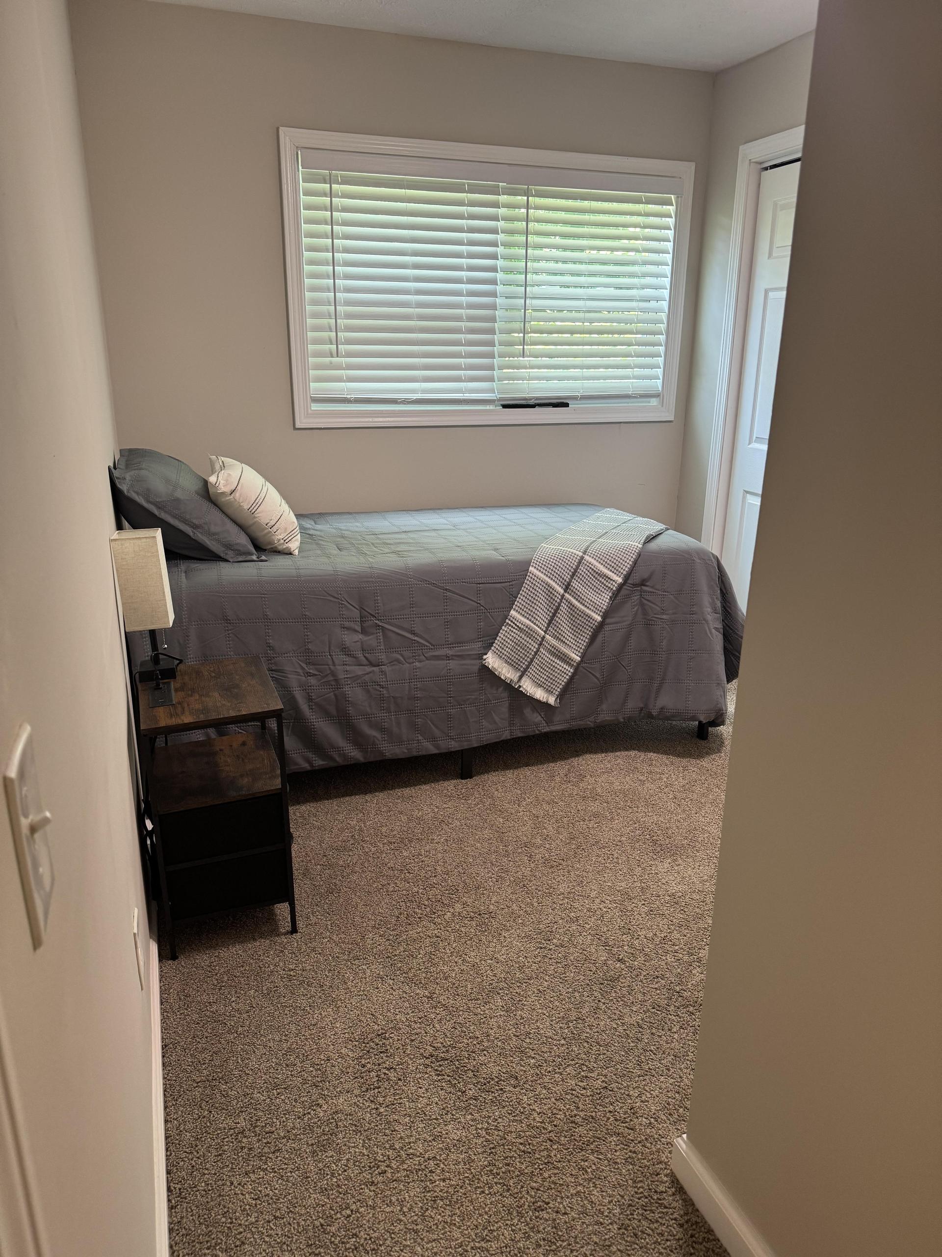 Twin bed w/ storage underneath and nightstand and lamp w/