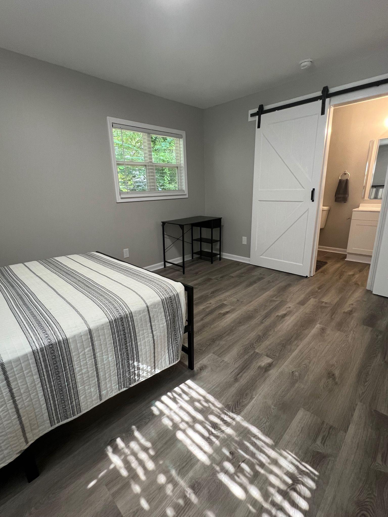 #5 - Large Corner Bedroom - Includes closet, mini fridge, tv, nightstand, writing desk, chair and ensuite bathroom