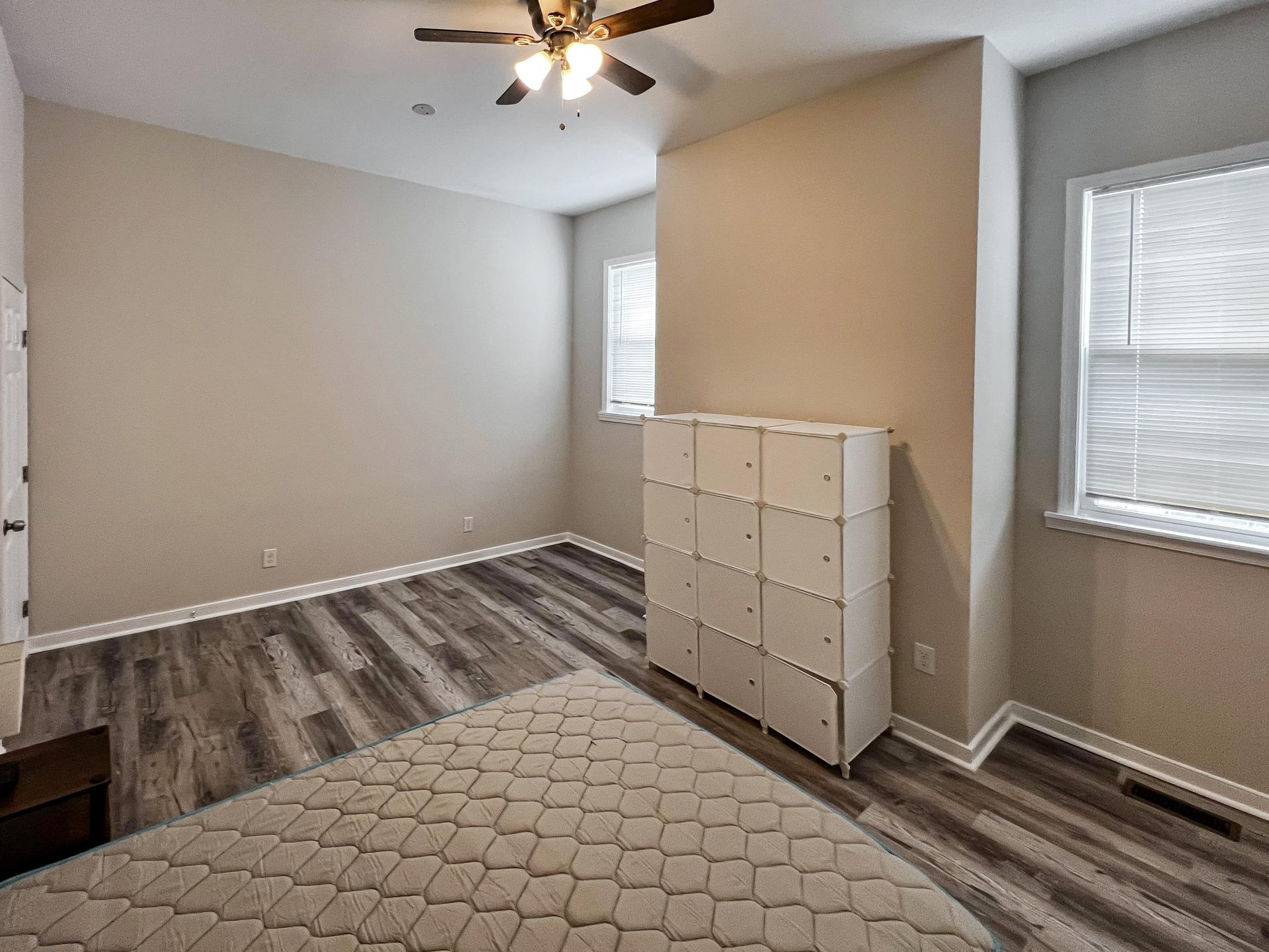 bedroom, detected: ceiling fan, window blind, carpet