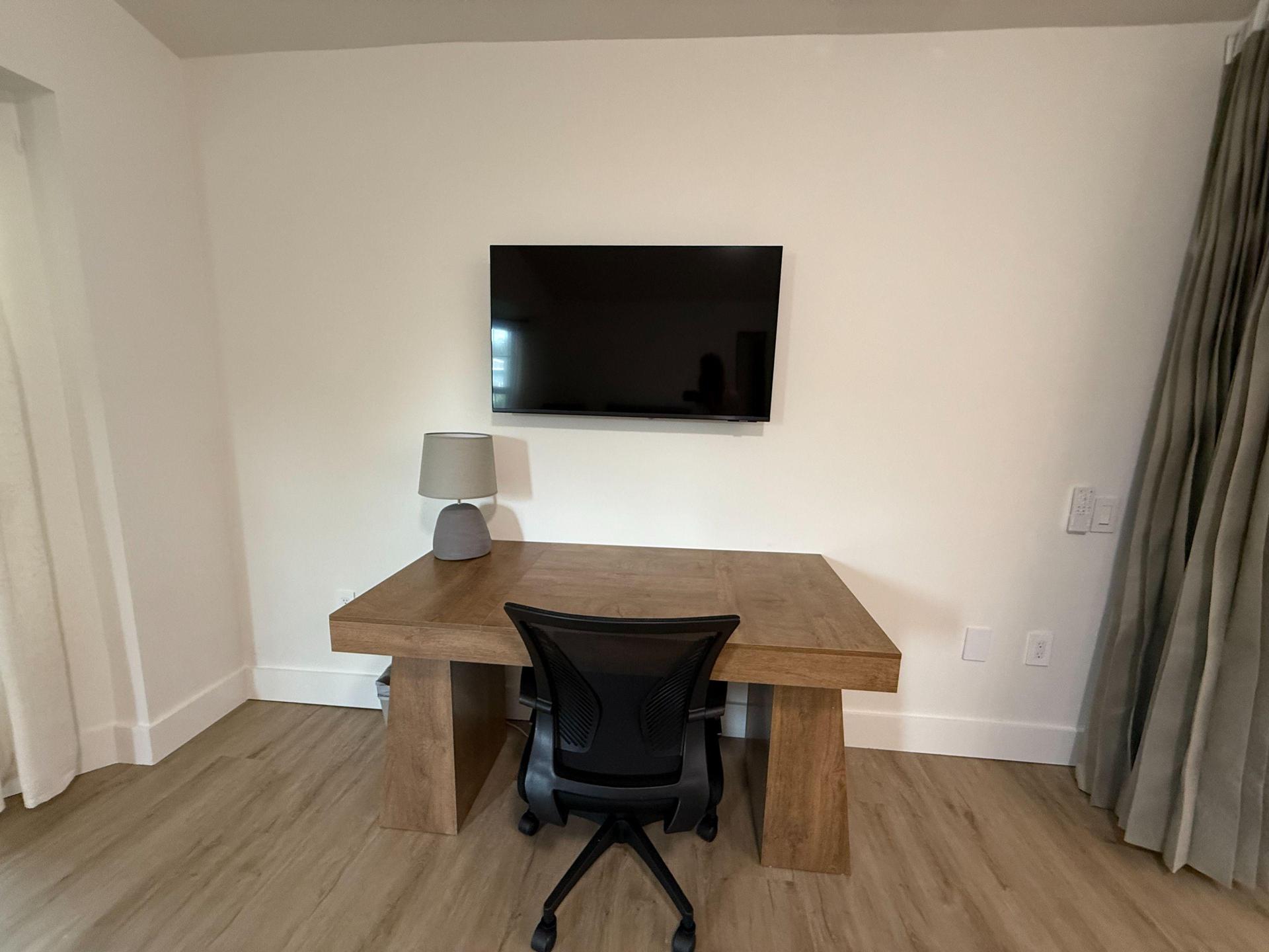 43" tv, ceiling fan with light & remote, to close the room there is a floor to ceiling curtain only (no 4th wall no door)