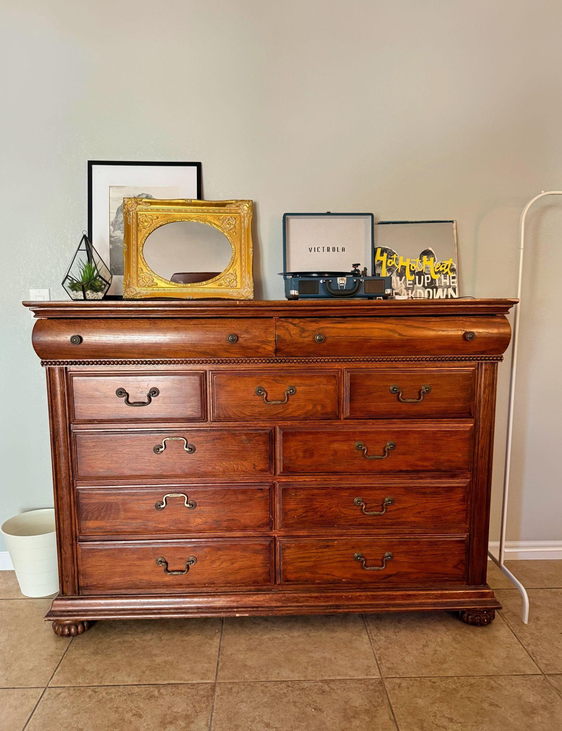 Dresser with mirror and record player.