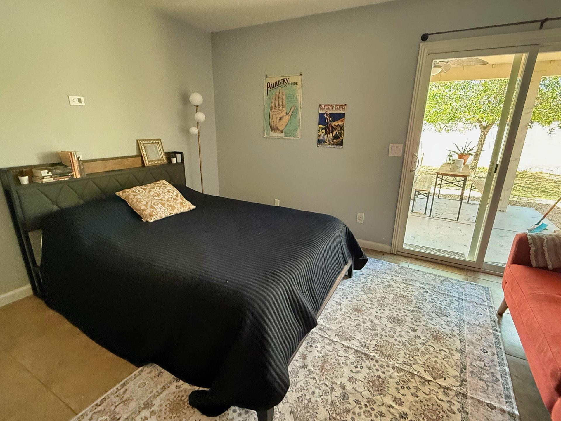 Queen size bed with shelf built into headboard.