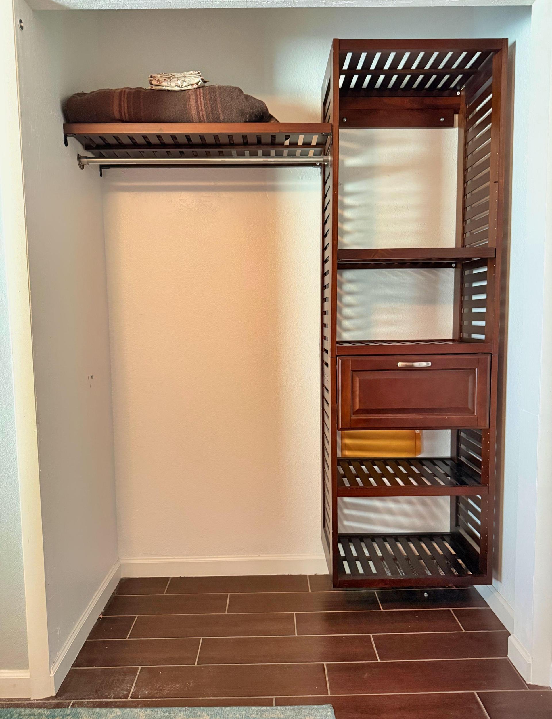 Closet space with additional storage.