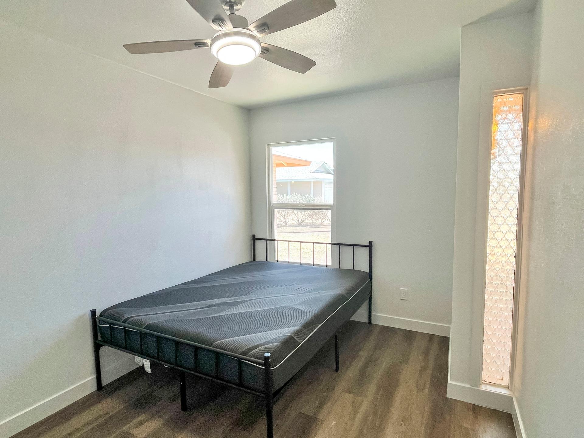 bedroom, detected:bed, ceiling fan, window blind