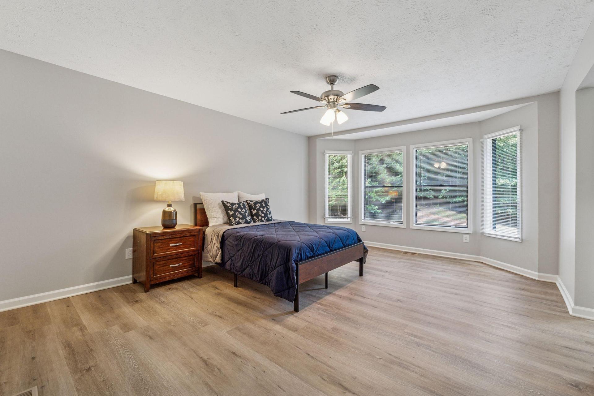 Huge master bedroom with bay window, large walk-in closet, private bath.