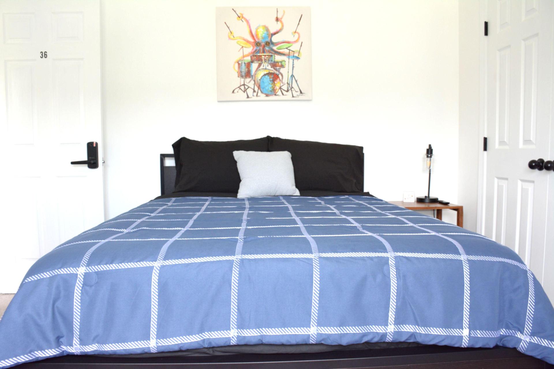 Full bed with side table and lamp