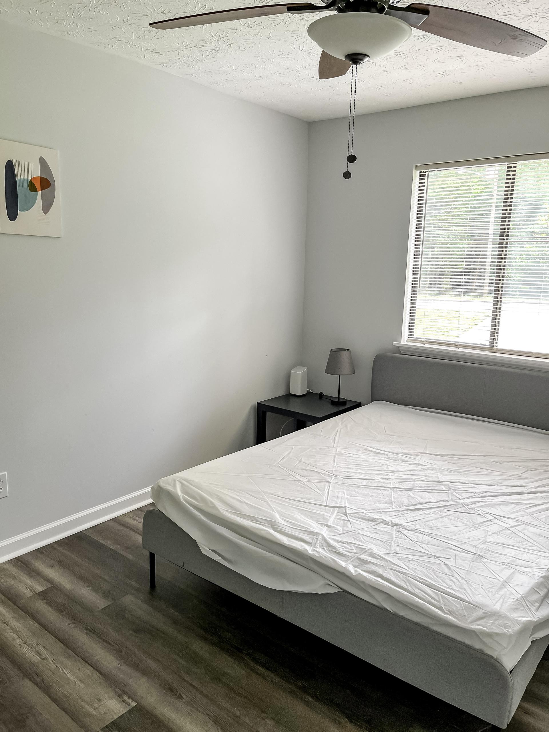 bedroom, detected: window blind, ceiling fan, bed