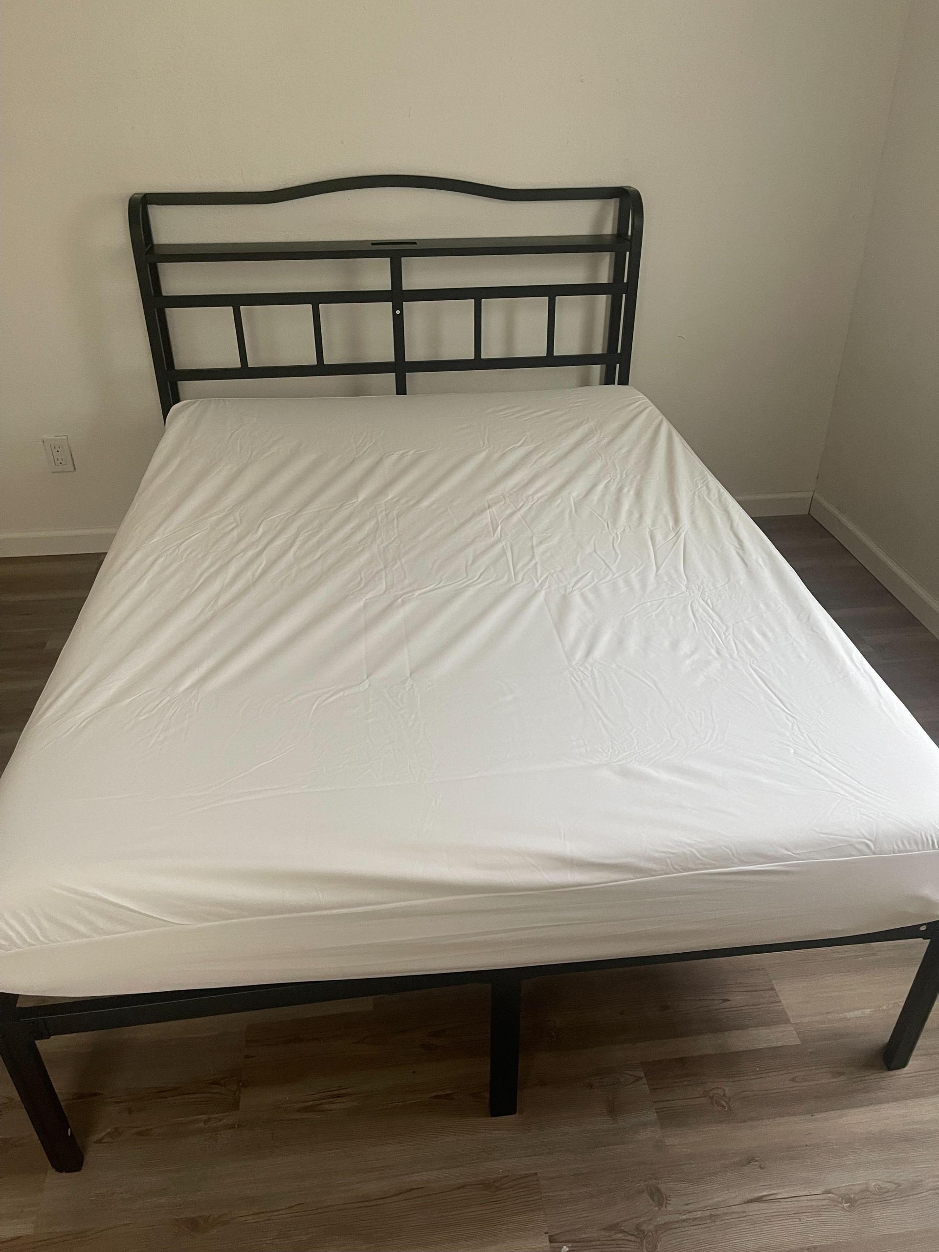 full/double bed frame, mattress and pad.