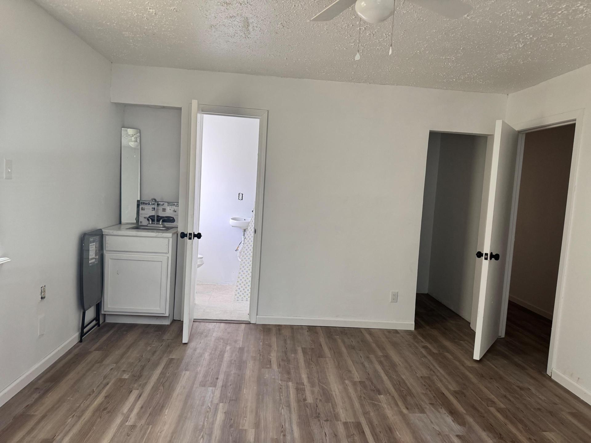 kitchenette, bathroom and walk-in closet view