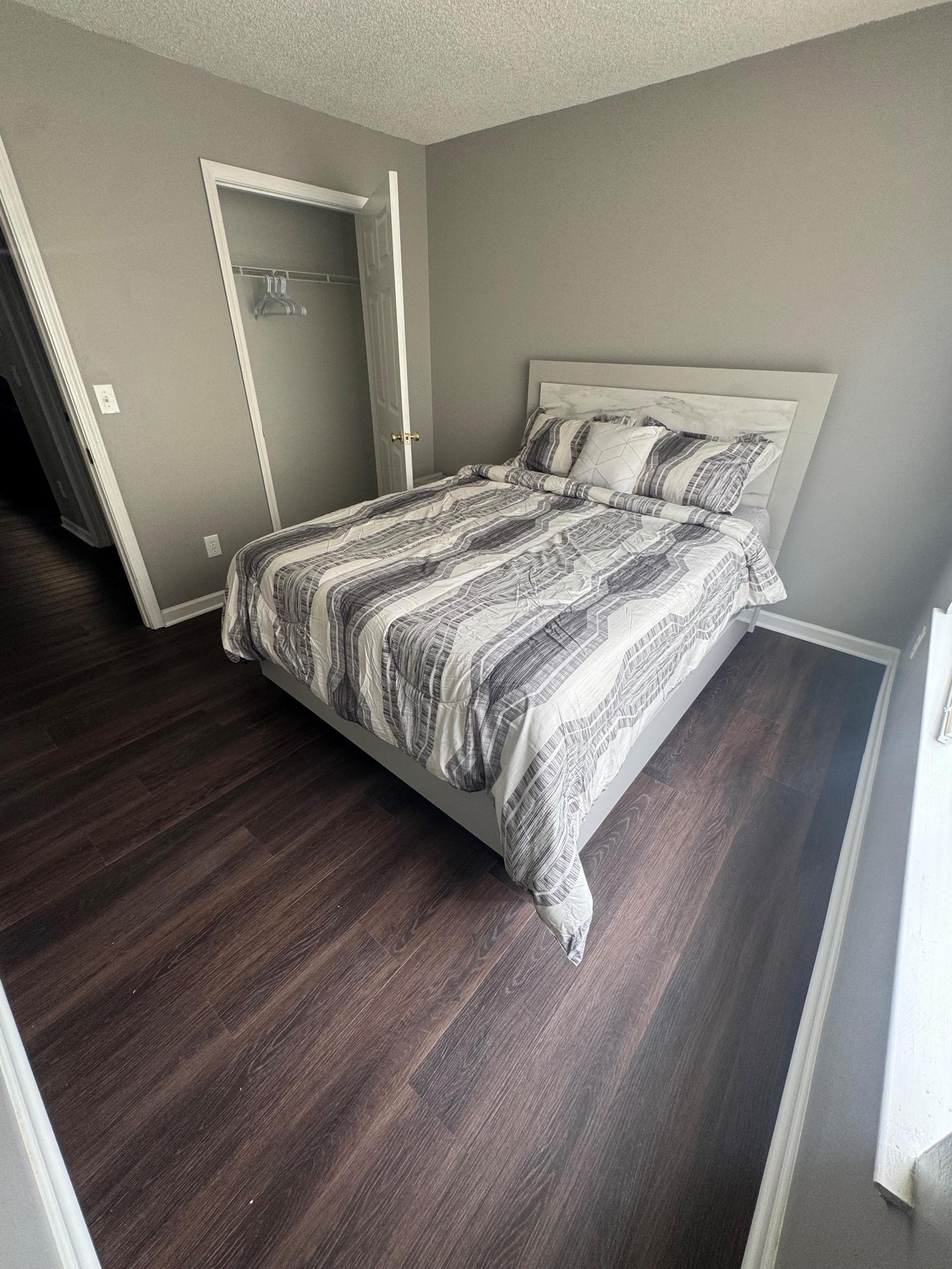 Room with dresser and reach in closet