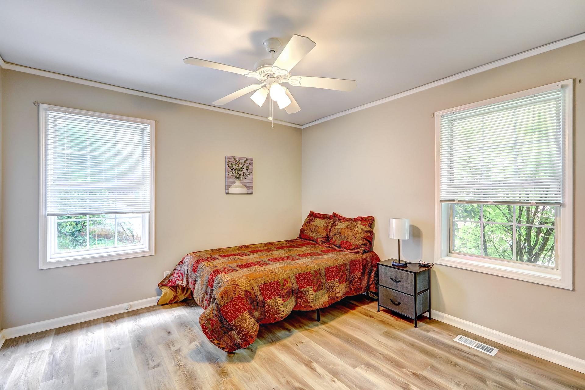bedroom, detected: window blind, ceiling fan, bed