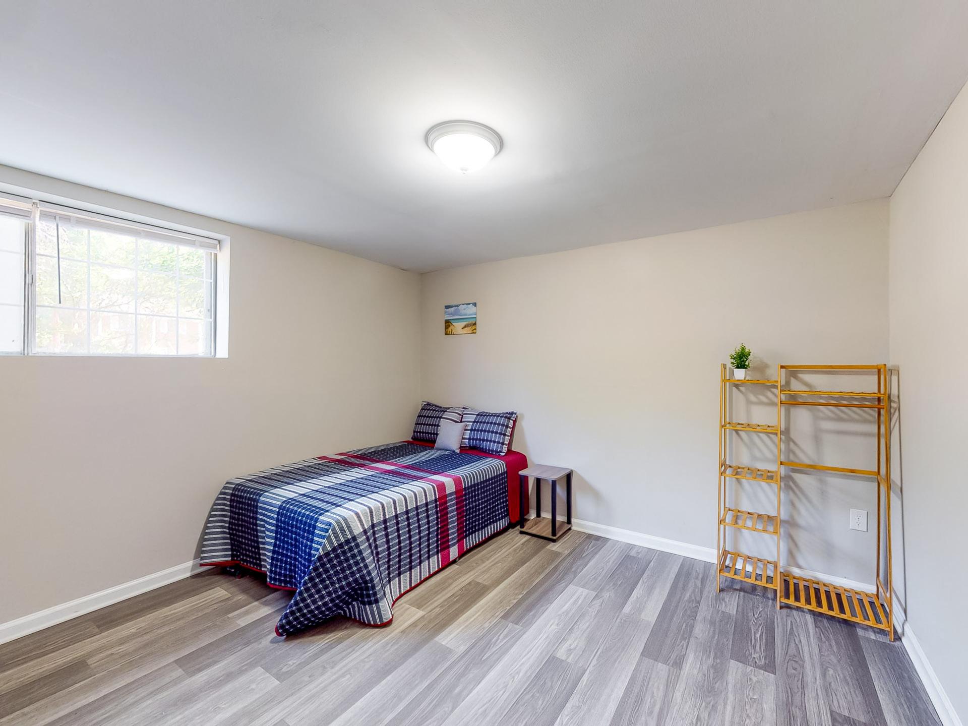 downstairs floor, full-bed, with wide street view window. The bathroom is across the hall.  Largest room size of 19'0"x12'8"