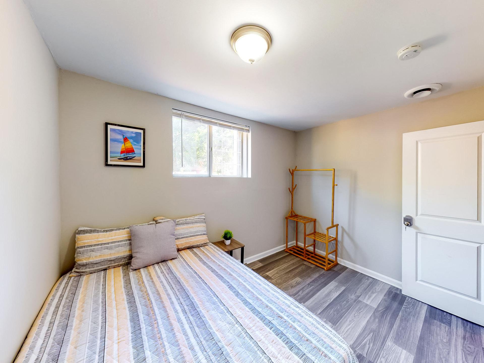 downstairs floor, full-bed, with street view window. Room size of 11'1"x8'6"